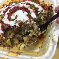 76 Steak & Potato - Potatoes with cheese, ground beef, onions, mushrooms, and sour cream