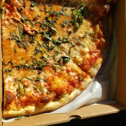 Italy's Pizza & Pasta Company - Two slices, with basil.