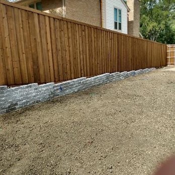 ND Fence - Retaining wall with 8' board-on-board cedar - Fences & Gates Near Me