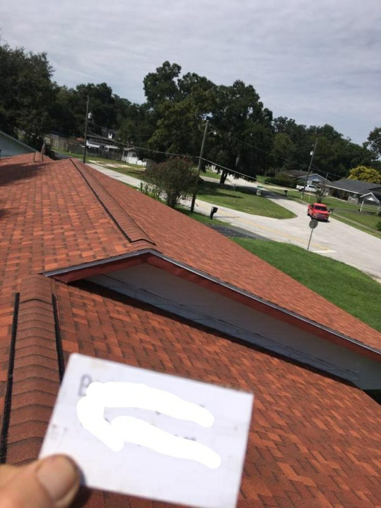 Slide of Waylon's Watertight Roofing