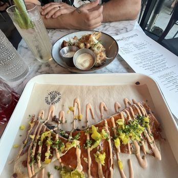 Broken Spirits Distillery - The brisket quesadilla and garlic Parmesan wings, with a side of smoky hand crafted beverages - Distilleries Near Me - Long Beach, California