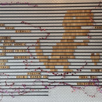 CHIBI Ramen - Dinosaur decoration near the main entrance with small valentines decorations - Ramen Near Me - Orlando, Florida