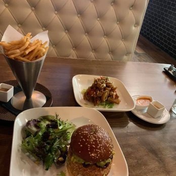 The Conche - Lunch prices: Garlic Parmesan Fries ($6), Crab Cake Burger ($20), Crispy Calamari ($10) - Cocktail Bars Near Me - Leesburg, Virginia