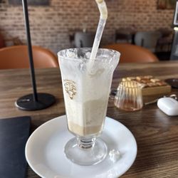 ArtAro Cafe - Iced Vanilla Latte with whipped cream.