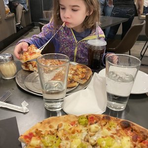 Photo of Elemental Pizza - Seattle, WA, United States. A 6-year old loving the kids pizza (with chicken)