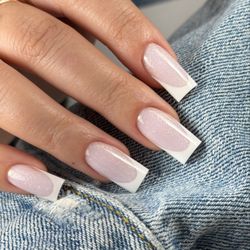 Viktoriia Horova - Quiet Luxury: a clean French manicure with balanced nail architecture and a thin, strong hard gel overlay.