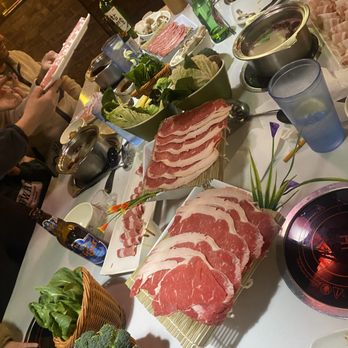Lao Pot - some of the sliced beef, broccoli, bok choy, (you can see the hot pots in the background) - Hot Pot Near Me - Madison Heights, Michigan