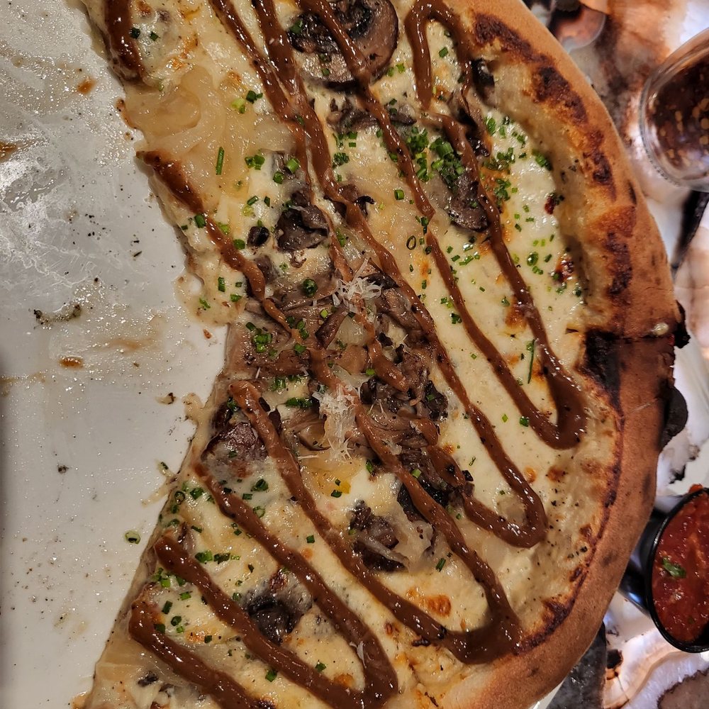 Graffito Pizza - I moved the toppings over the other slices only had the drizzle - Pizza Near Me - Savannah, Georgia Graffito Pizza - I moved the toppings over the other slices only had the drizzle - Pizza Near Me - Savannah, Georgia