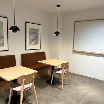 SPACES Hollywood - Tables to work at by the elevators - Shared Office Spaces Near Me - Los Angeles, California SPACES Hollywood - Tables to work at by the elevators - Shared Office Spaces Near Me - Los Angeles, California