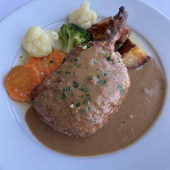 Pier 95 Restaurant - Marina - Stuffed Pork Chop with Prosciutto and a side of sautéed veggies yummy! - Seafood Near Me - Freeport, New York