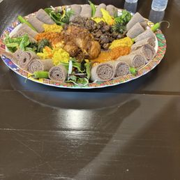 14B. Tibs Beef 19. Veggie Combo 25. Doro wot Plate of delicious food served with injera and serrano peppers 14B. Tibs Beef 19. Veggie Combo 25. Doro wot Plate of delicious food served with injera and serrano peppers