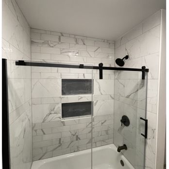 Reimagined Spaces - New tile tub surround, niches and shower fixtures+glass door - General Contractors Near Me - Clifton Springs, New York Reimagined Spaces - New tile tub surround, niches and shower fixtures+glass door - General Contractors Near Me - Clifton Springs, New York