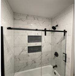 Reimagined Spaces - New tile tub surround, niches and shower fixtures+glass door
