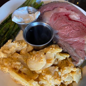 Patini's Grill - Medium rare prime rib with au gratin, potatoes and asparagus. - American Near Me - Stanwood, Washington Patini's Grill - Medium rare prime rib with au gratin, potatoes and asparagus. - American Near Me - Stanwood, Washington