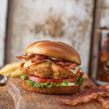 Slim Chickens - a chicken sandwich with bacon and lettuce - Chicken Wings Near Me - Tallahassee, Florida