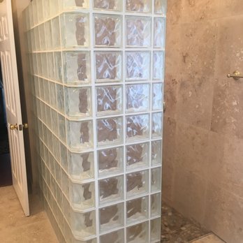 Elements Construction & Restoration - Glass block and travertine are a great combination. - Roofing Near Me - Willis, Texas
