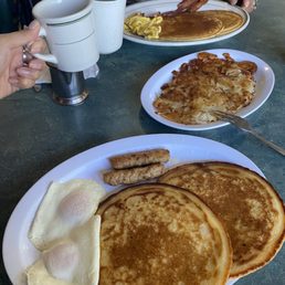 (Front) Egg haters special with hash brown and early bird special. (Front) Egg haters special with hash brown and early bird special.