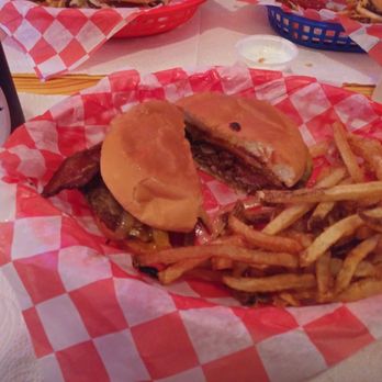 Pop's Burger Stand - The slow cooked burger cut in half with fries. - Burgers Near Me - Waxahachie, Texas