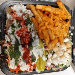 Halal Munchies - Combo over rice, you have your choice of fries and salad or hummus
