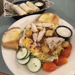 Grilled chicken salad and a side of their egg rolls. Grilled chicken salad and a side of their egg rolls.
