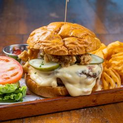 Kentucky Burger featured on our Monday weekly special - 50/50 Short Rib Brisket Blend, Fried Chicken Skin, Pickles, Smoked Gouda Bechamel