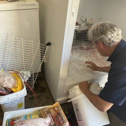 Algeo's Appliance Center - Our freezer stopped working and Ray is In the middle of repairing it! Come to find out the drain was plugged.