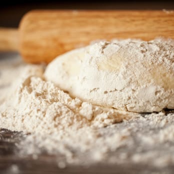 Little Sicily - a dough on a table with a rolling pin - Pizza Near Me - Somerdale, New Jersey Little Sicily - a dough on a table with a rolling pin - Pizza Near Me - Somerdale, New Jersey