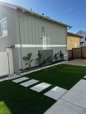 Modern Backyard Transformation | Turf, Deck & Water Feature - Complete backyard transformation with composite decking, artificial turf, stepping stone walkway, and a custom modern water feature.
Designed to create a clean, low-maintenance outdoor space that’s perfect for relaxing and entertaining. Modern Backyard Transformation | Turf, Deck & Water Feature - Complete backyard transformation with composite decking, artificial turf, stepping stone walkway, and a custom modern water feature.
Designed to create a clean, low-maintenance outdoor space that’s perfect for relaxing and entertaining.