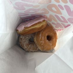 Dunkin' - Coconut, glazed and strawberry donut (it's supposed to have sprinkles on it)