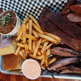 Fries, cornbread, ribs, brisket, beans and sausage