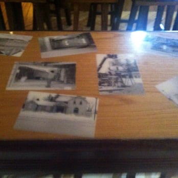 Queens Bush Pub - Old photos in the table - Pubs Near Me - Hanover, Ontario