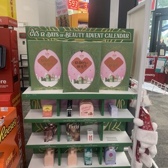 CVS Pharmacy - Beauty advent calendars.  What a novel idea! - A CVS store shelf features a 12 Days of Beauty Advent Calendar display along with beauty products like makeup and skincare items. - Drugstores Near Me - Temecula, California