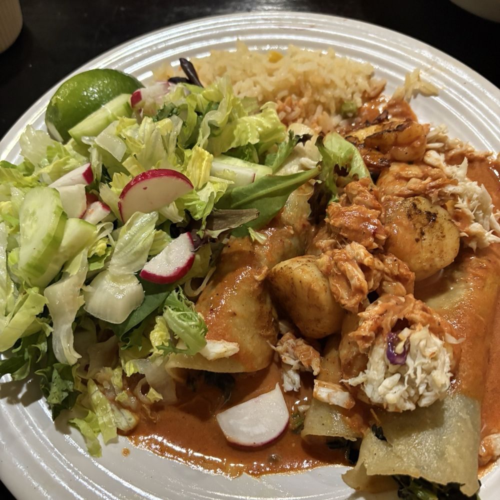 Seafood enchiladas with side salad Seafood enchiladas with side salad