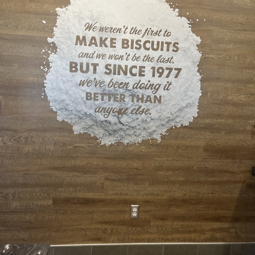 a sign on the wall of a restaurant