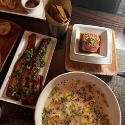 Thick cut Bacon. Tuna Tartare. Sashimi Yellowtail Thick cut Bacon. Tuna Tartare. Sashimi Yellowtail