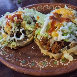 Chiltepinos - Sopes. One chicken mole and one carnitas. 40 pesos each. Yup, $2