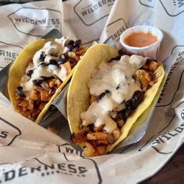 Vegan papas tacos - sweet potatoes and black beans. Not sure if it had cauliflower Vegan papas tacos - sweet potatoes and black beans. Not sure if it had cauliflower