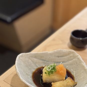 Torishin - a bowl of food on a table - Japanese Near Me - New York, New York