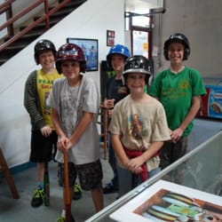 Lumberyard Baseball Academy - Kids getting helmets and bats for the birthday party at Lumberyard Baseball Academy.