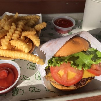 Shake Shack Boca Raton - Juicy ShackBurger with an order of fries - Burgers Near Me - Boca Raton, Florida Shake Shack Boca Raton - Juicy ShackBurger with an order of fries - Burgers Near Me - Boca Raton, Florida