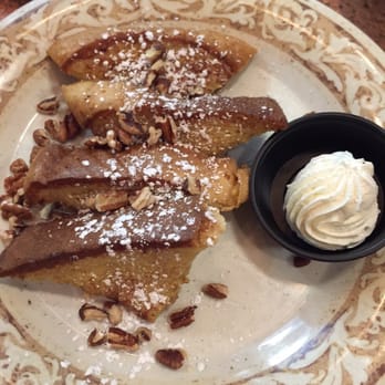 Another Broken Egg Cafe - My single slice of French toast plus pecans for an added charge. - Breakfast & Brunch Near Me - Burbank, California Another Broken Egg Cafe - My single slice of French toast plus pecans for an added charge. - Breakfast & Brunch Near Me - Burbank, California