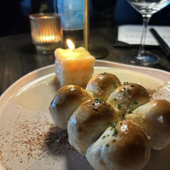 The Saint - Parker House Rolls with tallow candle for dipping - Steakhouses Near Me - Dallas, Texas The Saint - Parker House Rolls with tallow candle for dipping - Steakhouses Near Me - Dallas, Texas