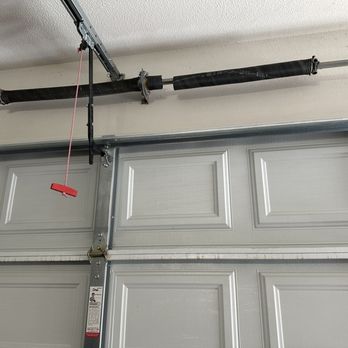 Coverall Garage Doors - Old broken spring - Garage Door Services Near Me Coverall Garage Doors - Old broken spring - Garage Door Services Near Me
