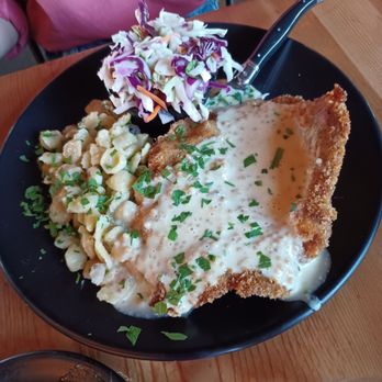 Monkless Belgian Ales - Pork schnitzel plate with herb & butter spaetzle(pasta), and apple cabbage slaw - $23. - Belgian Near Me - Bend, Oregon Monkless Belgian Ales - Pork schnitzel plate with herb & butter spaetzle(pasta), and apple cabbage slaw - $23. - Belgian Near Me - Bend, Oregon