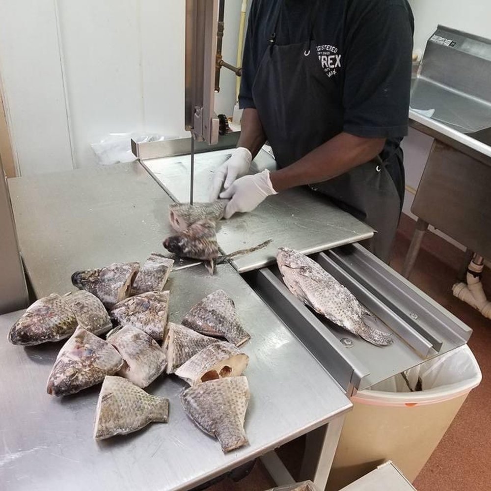 Carolina Internationa Mart - a chef preparing fish - International Grocery Near Me - Raleigh, North Carolina