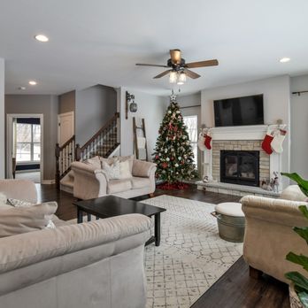 Aspen Homes - a living room with a christmas tree - General Contractors Near Me - Pewaukee, Wisconsin Aspen Homes - a living room with a christmas tree - General Contractors Near Me - Pewaukee, Wisconsin