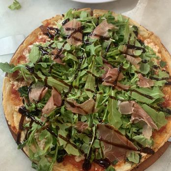 Baci - Arugula prosciutto pizza with balsamic glaze on top - Pizza Near Me - New Smyrna Beach, Florida