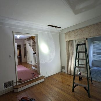 Michael Slayton General Contracting - an empty room with a ladder - General Contractors Near Me