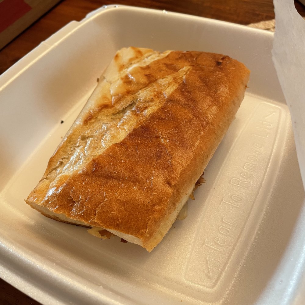 a sandwich in a styrofoam container a sandwich in a styrofoam container
