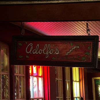 Adolfo's - a sign hanging from the ceiling - Seafood Near Me - New Orleans, Louisiana